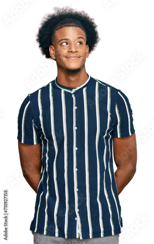 African american man with afro hair wearing casual clothes smiling looking to the side and staring away thinking.