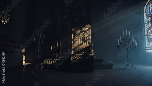 Bilde på lerret Large carved wooden throne in a dark church room