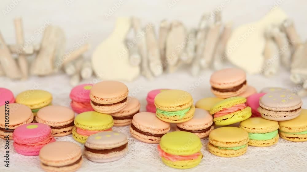 Appetizing cookies with cream on table next to wooden bird. Appetizing cookies with cream on table next to wooden bird.