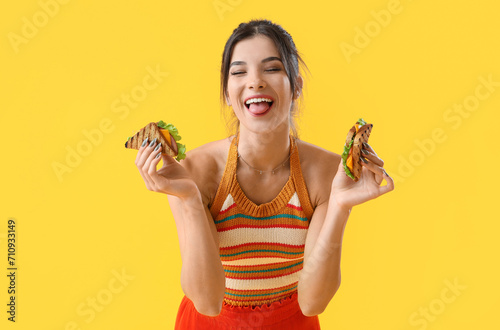 Young woman with tasty sand...