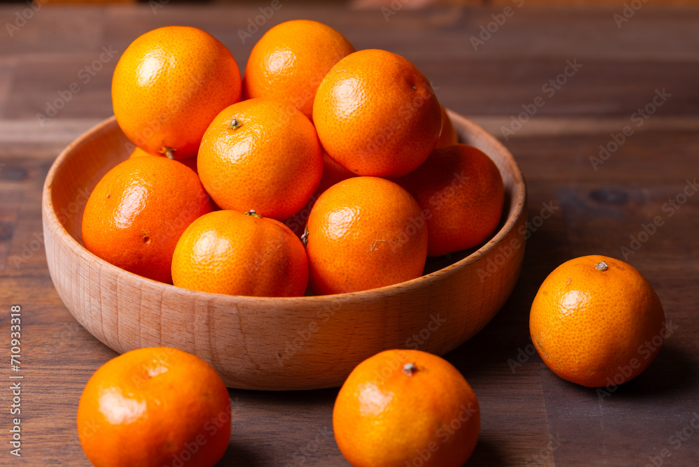 clementine mandarin fruit. mandarins in the wooden bowl. clementine mandarin fruit. mandarins in the wooden bowl.