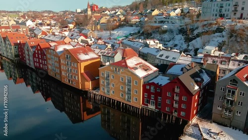 Colorful old houses at the nidelva river embankment in the center of trondheim old town, norway.  photo