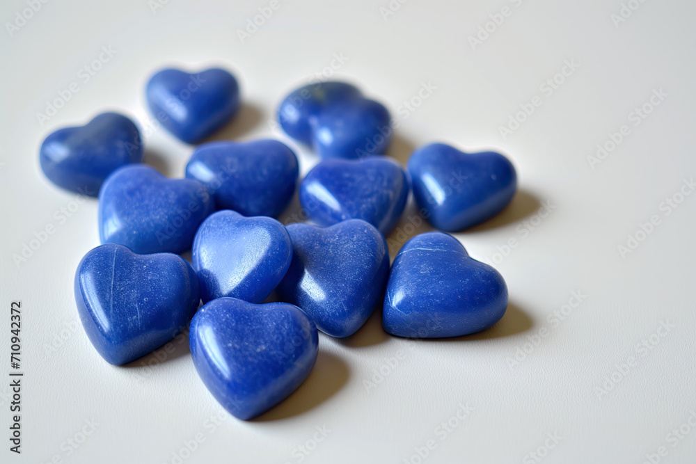 Blue heart shape stones on plain background Blue heart shape stones on plain background