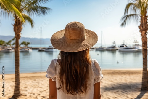 Relaxing Summer Beach Vacation. Happy Woman with Hat Against Palm Trees and Sea Beach © sorin