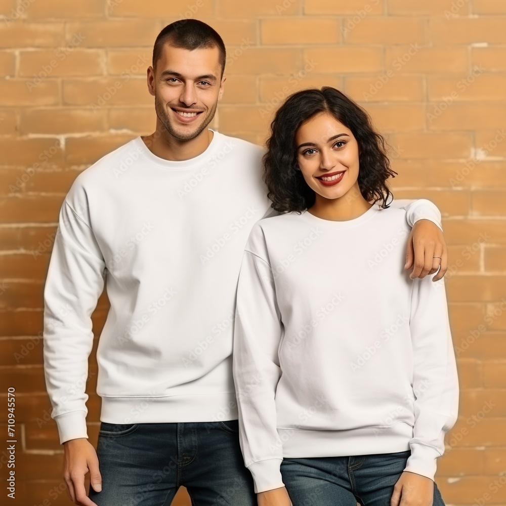 Smiling young couple wearing white sweaters Smiling young couple wearing white sweaters