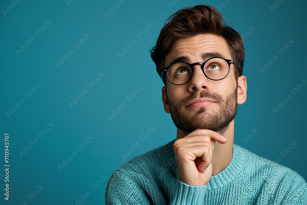 Portrait of creative wonderful person hand touching chin gaze empty space brainstorming isolated on blue color background