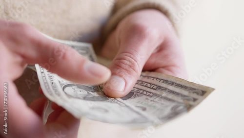 Dollar Counting Close-Up: Man's Hand Tallying One Dollar Bills