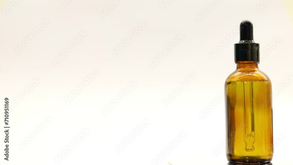 A bottle of cosmetics or care product rotates on a white background