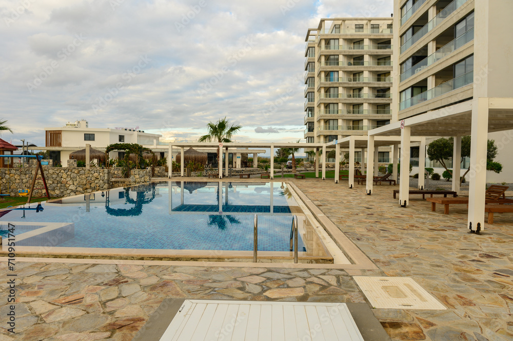 Fototapeta premium Swimming pool with blue water in a residential complex 2
