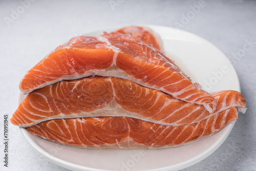 fresh, delicious salmon fillet on a white plate