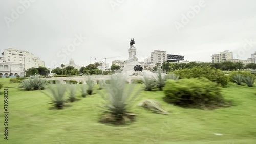 Tracking shot of Monument Maximo Gomez in Havana old city center in front of Malecon street photo