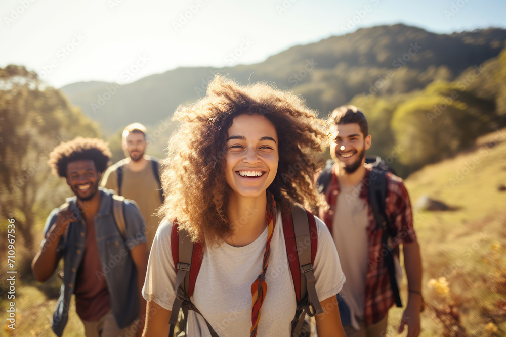 A diverse group of friends hiking in a scenery outdoors A diverse group of friends hiking in a scenery outdoors