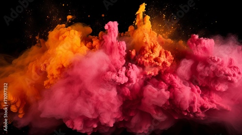 Mixing orange and pink powder holi colors with a black background.
