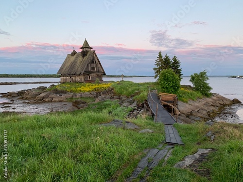 Wooden church on the shore of the White Sea near Rabocheostrovsk, Karelia, Russia, June 2019 photo