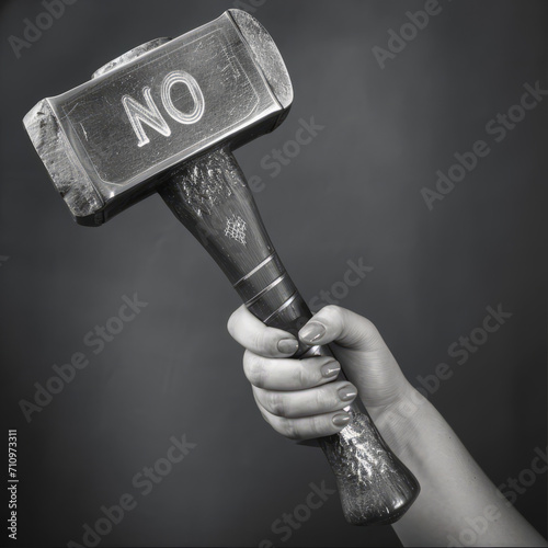 Girl holding a Viking hammer with the inscription “No”. photo