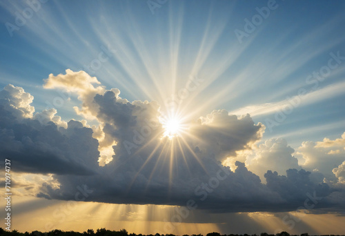 Ethereal sun rays through golden clouds. A divine glow in the sky for hope and faith. Trust in a higher power. Gorgeous sunlight and fluffy clouds above. photo