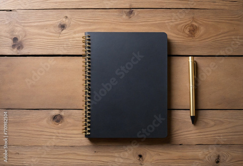 Elegant Black and Gold Spiral Notebook on Wooden Table with Copy Space