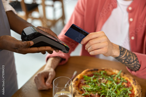 Close up picture of mans hand holding credit card