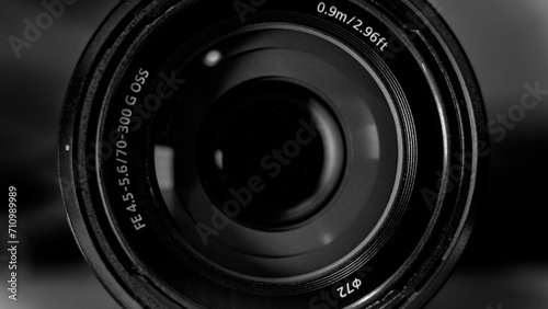 Macro photo of a 70-300mm Camera Lens with a dark motif and subtle light reflections photo