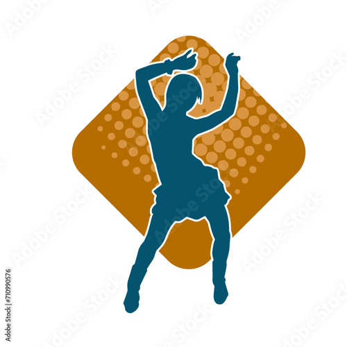 Silhouette of a female dancer in action pose. Silhouette of a woman dancing happily.