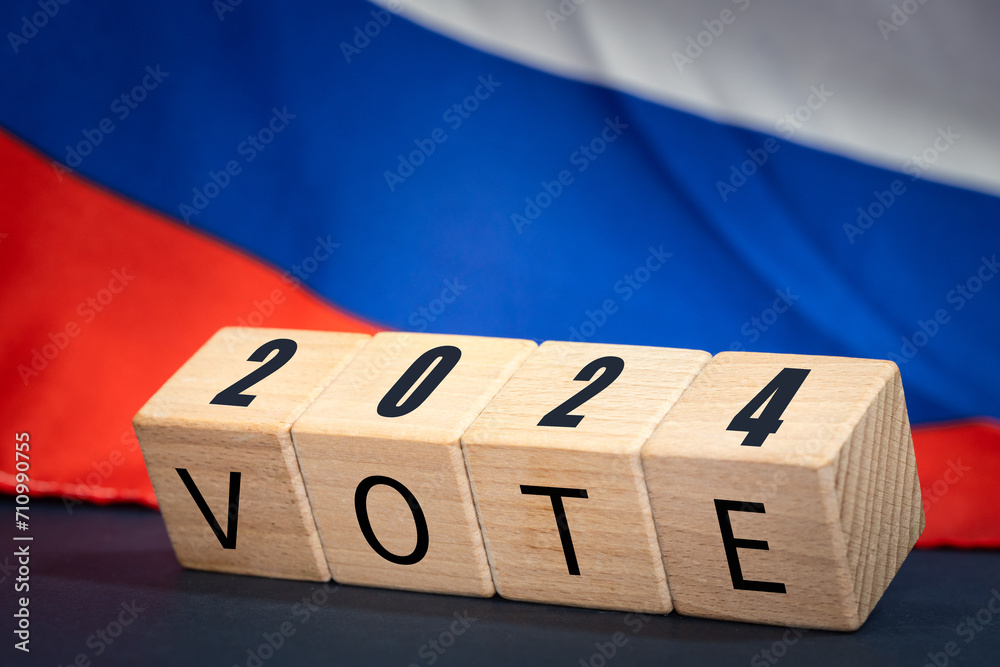 Φωτογραφία Russia vote 2024, Wooden blocks written vote 2024, Russian flag in the background