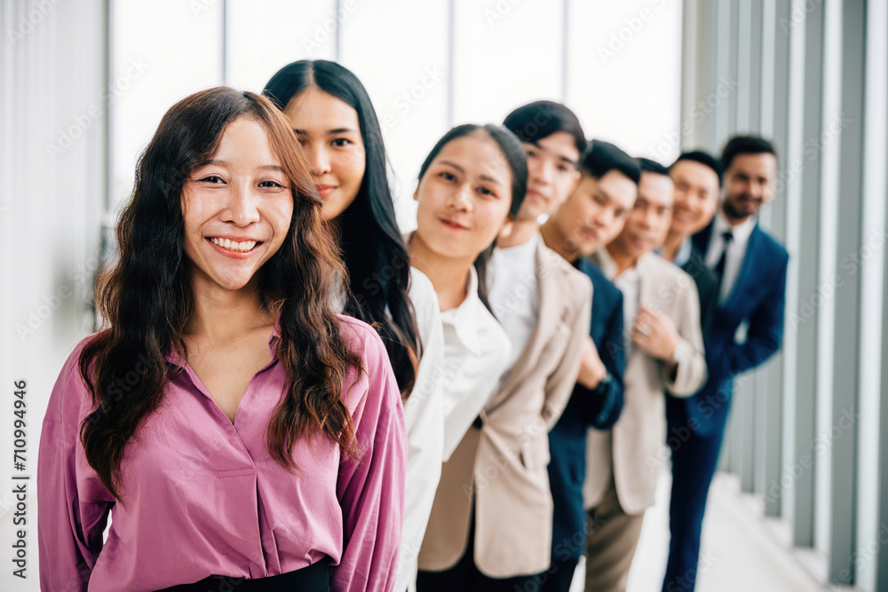 A vibrant group portrait of young business professionals in the office, crossing their arms with pride. This diverse and confident team embodies the values of teamwork and success. A vibrant group portrait of young business professionals in the office, crossing their arms with pride. This diverse and confident team embodies the values of teamwork and success.