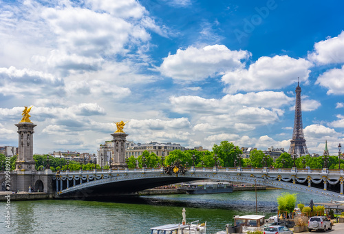 Alexandre III Bridge and Eiffel Tower in background in Paris, France. Eiffel Tower is one of the most iconic landmarks of Paris. Cityscape of Paris