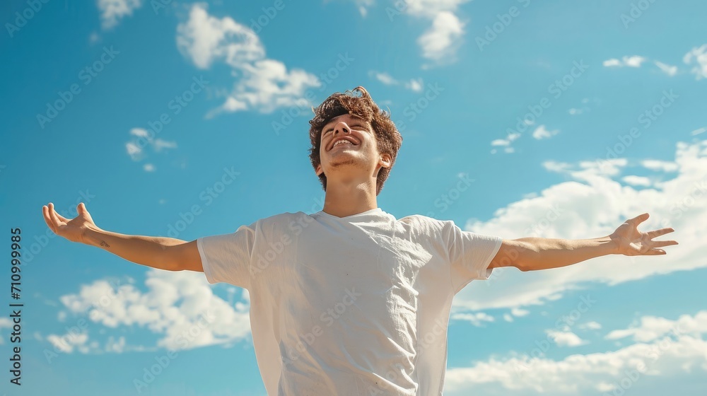 happy person young man with arms outstretched having a positive mindset happy person young man with arms outstretched having a positive mindset