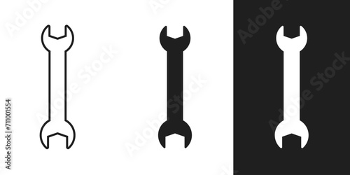 Wrench icon on black background.