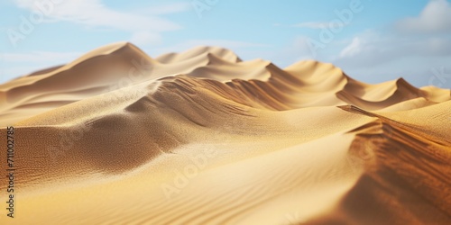 Desert landscape featuring sand dunes under a clear blue sky. Perfect for travel and adventure themes