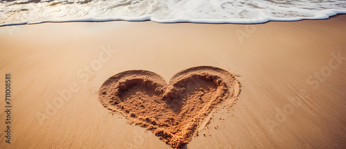 A beautiful beach with two hearts sketched in the sand. photo