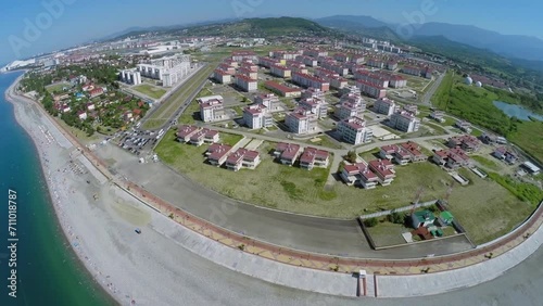 Coastal town with radio station near sea beach at summer photo