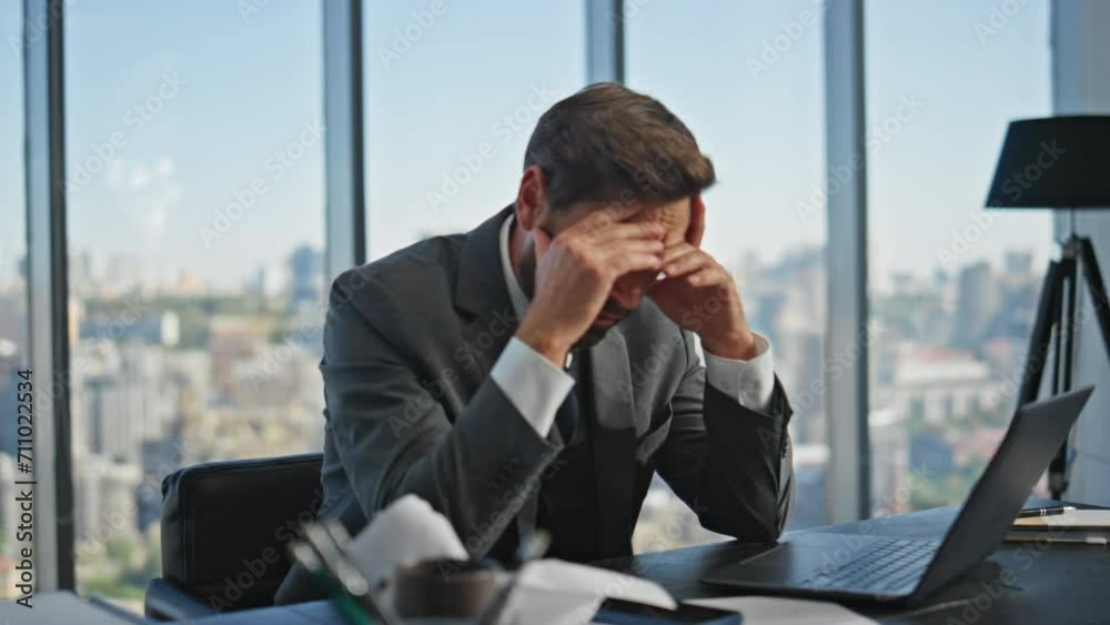 Upset manager ending call tapping smartphone. Frustrated businessman thinking Upset manager ending call tapping smartphone. Frustrated businessman thinking