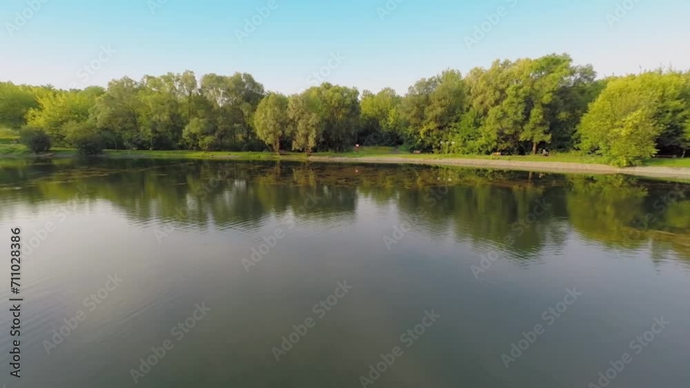 Teenager fishing on inflatable boat at pond in summer Teenager fishing on inflatable boat at pond in summer