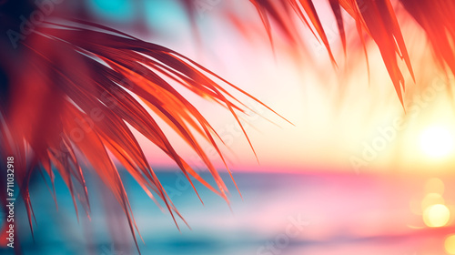 Summer vacation  defocused background blurred sunset over the ocean and palm leaves frame banner