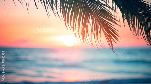 Summer vacation  defocused background blurred sunset over the ocean and palm leaves frame banner © KEA