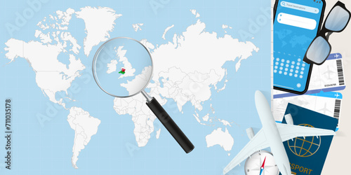 Wales is magnified over a World Map, illustration with airplane, passport, boarding pass, compass and eyeglasses.