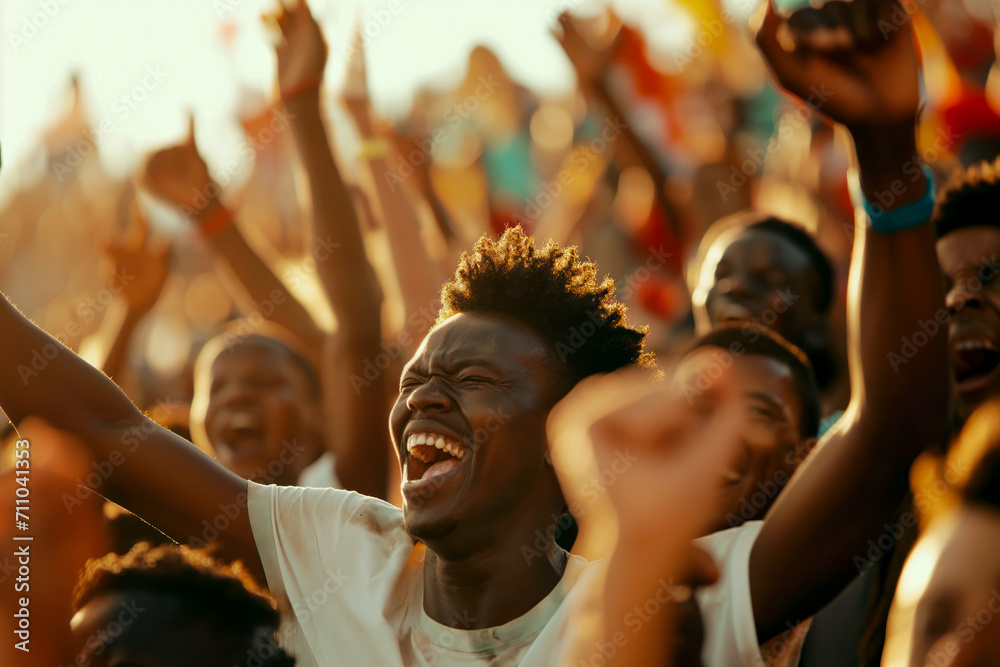 A group of African fans cheering for their national football team A group of African fans cheering for their national football team