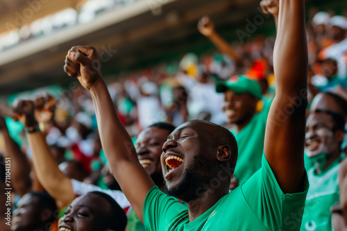 A group of Nigerian fans cheering for their national football team