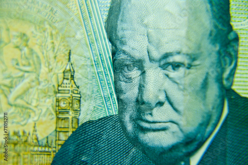 London, UK, 2 January 2024: British five pounds sterling banknote  closeup with selective focus. Portrait of Sir Winston Churchill, Prime Minister of the United Kingdom  photo