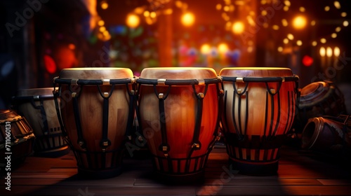 Conga drums on stage, lit by warm stage lights with bokeh effect. Perfect for music themed projects and performance promotions. Traditional percussion musical instrument of Afro-Cuban