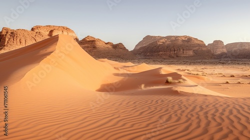 Beautiful desert landscape with large sand dunes in the foreground and mountains in the background photo