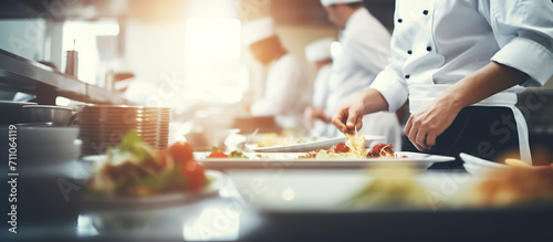 Professional Chefs Preparing Gourmet Salads in Commercial Kitchen photo