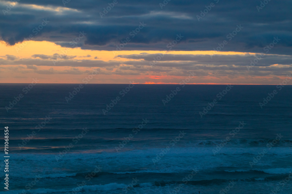 A Golden Dawn Breaks Over Gold Coast’s Tranquil Sea