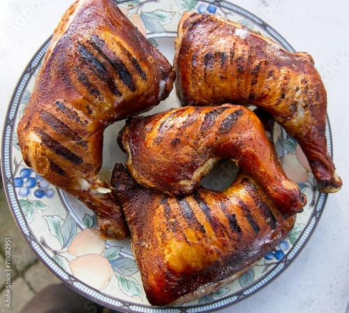Whole chicken legs smoked and grilled, top down view