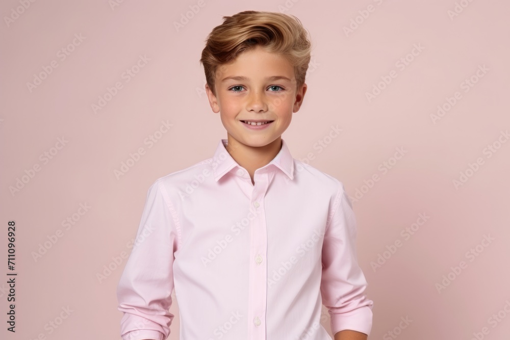 Portrait of a little boy in a shirt on a pink background Portrait of a little boy in a shirt on a pink background