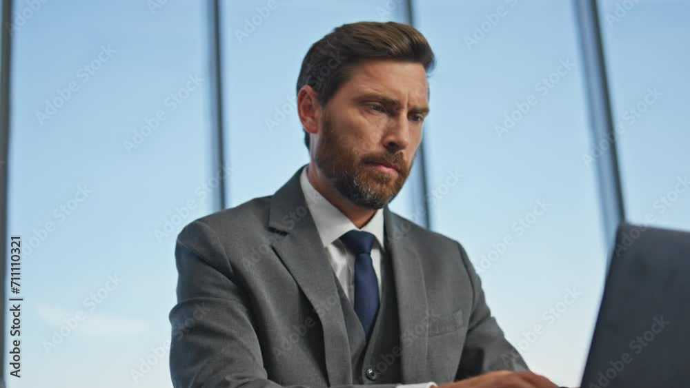 Serious worker typing email working computer closeup. Office man closing laptop Serious worker typing email working computer closeup. Office man closing laptop