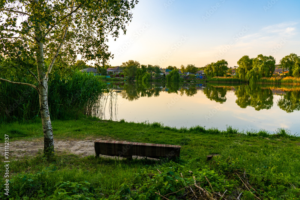 Lake in the village. Background with selective focus and copy space