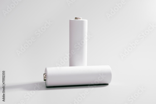 Two AA-sized white rechargeable 1.2V batteries photo