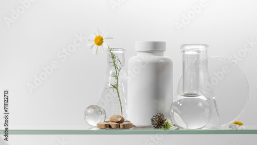 A white jar with vitamins or herbal medicines on a glass shelf. Medicines